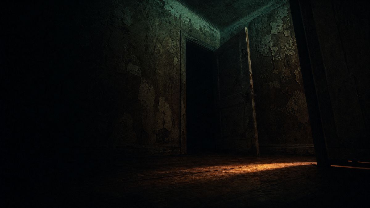 A dark corridor interior lit by a single warm lamp, deep shadows across the floor.